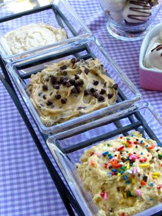 three trays filled with different types of food