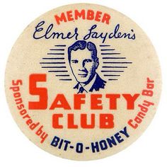 a button with the words 5 safety club written in red and blue ink on it