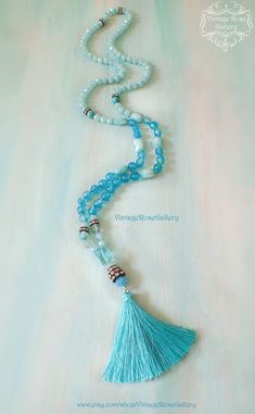 "Turquoise Silk Tassel Necklace, Turquoise Agate Gemstones Necklace, Turquoise Boho Chic Necklace, Bridesmaid Gift A gorgeous Turquoise Agate Gemstones, Hand knotted , Long Tassel Necklace with rhinestones and crystal beads ! Features antique rhinestones, beautiful turquoise agate faceted gemstones 8mm , light blue crystal beads of different shapes, an amazing aqua quartz , turquoise gemstones all carefully hand knotted and a gorgeous turquoise silk tassel This necklace is so beautiful , with so Turquoise Aquamarine Spiritual Necklace, Turquoise Aquamarine Round Bead Necklaces, Bohemian Aquamarine Jewelry, Bohemian Aquamarine Jewelry In Turquoise, Bohemian Aquamarine Turquoise Jewelry, Bohemian Turquoise Aquamarine Jewelry, Turquoise Agate Beaded Necklaces As Gift, Turquoise Agate Beaded Necklace As Gift, Turquoise Agate Beaded Necklace For Gift