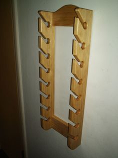 a wooden rack hanging from the side of a wall