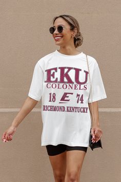 Whether you're cheering on your team from the sidelines or enjoying the festivities at the tailgate, our Eastern Kentucky Colonels Unity Oversized Crewneck Teeis sure to keep you looking and feeling fabulous all season long. Join the fashion game and make every game day unforgettable! Oversized Fan Apparel Tops For Game Day, Oversized Varsity T-shirt For Game Day, Oversized Collegiate T-shirt For College, Oversized T-shirt For Sports Events, Oversized Collegiate T-shirt For Game Day, Collegiate Tops With University Logo For Game Day, University Logo Sports Fan Tops, Collegiate Screen Print Tops For College, University Logo Tops For Fan Gear