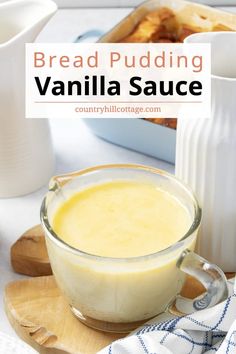 bread pudding with vanilla sauce in a glass bowl on a cutting board next to other dishes