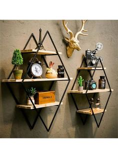 two shelving units with deer heads on the wall and other items in front of them