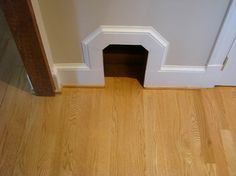 a dog door is open on the floor