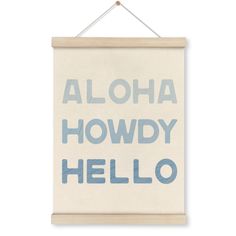 a sign hanging on the wall that says aloha howdy hello