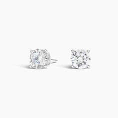 Four-Prong Round Diamond Stud Earrings. A beautifully matched pair of round diamonds are secured in classic, four-prong basket settings with comfortable posts for pierced ears. Earrings with a total carat weight of 1.00 carat or over will receive a guardian backing and earrings with a total carat weight under 1.00 carat will receive a push backing. Round Diamond Stud Earrings, Round Cut Diamond Earrings, Diamond Earrings Studs Round, Detailed Jewelry, Diamond Stud Earrings, Diamond Stud, Accessories Jewelry Earrings, Diamond Design, Round Earrings