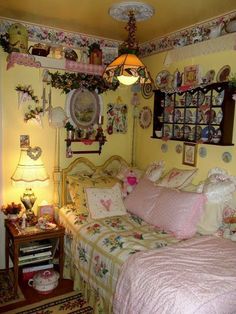 a bedroom with yellow walls and pink bedding