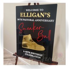 a sign with a gold sneaker on it and the words, welcome to gilligan's 50th pastoral anniversary