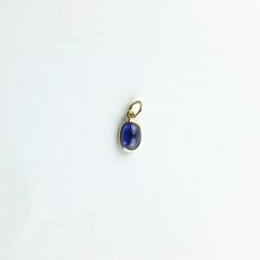 Material: 14k solid yellow gold (not gold plated or gold filled) Main Stone: Sapphire Main Stone Color: Blue Main Stone Shape: Oval Main Stone Creation: Natural Stone Size: 7x5 mm Carat Weight: 1.14 Carats Oval 14k Gold Gemstones For Gift, Oval 14k Gold Gemstones As Gift, 14k Yellow Gold Gemstones For Gift, Dainty Oval Cabochon Birthstone Jewelry, Gold Oblong Gemstone Jewelry, Yellow Gold Polished Oval Cabochon Gemstones, Polished Yellow Gold Oval Cabochon Gemstones, Yellow Gold Oval Cabochon Gemstone With Polished Finish, Oval Gold Gemstones In Sterling Silver