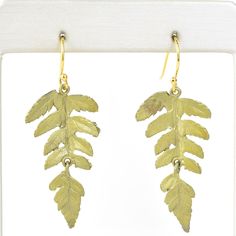 Handmade in the USA Bronze with soft green patina Gold filled french ear wires Earrings measure 1.5" long ABOUT SILVER SEASONS Silver Seasons Jewelry collection is brought to you by designer Michael Michaud. Known for his nature-inspired metal work, Michaud casts his pieces from real plant life and other natural specimens. Designs include everything from statement leaf necklaces to realistic flower earrings, bangle bracelets, drop earrings, and pendants. ABOUT GOLDMAKERS Goldmakers Jewelry creates and curates a comprehensive selection of artfully designed hand-crafted jewelry. We aspire to offer the jewelry enthusiast access to affordable classics as well as fresh innovative designs. Green Brass Earrings Nature-inspired, Nature-inspired Drop Earrings With Lever Back Ear Wires, Botanical Green Jewelry With Ear Wire, Botanical Leaf-shaped Earrings With Ear Wire, Nature-inspired Leaf Shaped Brass Jewelry, Nature-inspired Leaf-shaped Brass Jewelry, Leaf-shaped Brass Earrings With Ear Wire, Hand Forged Bronze Nature-inspired Earrings, Green Hand Forged Brass Earrings