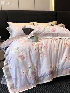 a bed with white and pink flowers on it