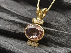 Gold Morganite Pendant set with Created Morganite in a perfect diamond cut & flawless clarity, size 10x8mm with small CZ Diamonds (3 Cts). Gold Oval Pendant design made of Gold Vermeil ☞ thickest 18k Gold Plating on top of Solid 925 Sterling Silver ☞ made to last.Click here for ☞ Matching Ring Click here for ☞ Matching Earrings Details:• Created Morganite in a flawless clarity & CZ Diamonds• Morganite: 10x8mm, 3 Ct, diamond cut• Pendant Height 21mm, Width 10mm• Free Complimentary Chain• 18k Gold Elegant Gold Oval Gemstones, Elegant Oval Gold Gemstones, Gold Oval Gemstones With Brilliant Cut, Elegant Gold Oval Pendant Gemstones, Elegant Pink Oval Link Jewelry, Pink Oval Pendant For Formal Occasions, Pink Oval Pendant Jewelry For Formal Occasions, Morganite Pendant, Oval Necklace