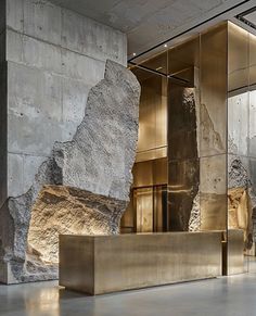 the interior of an office building with large rocks