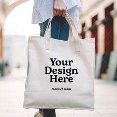 Instantly enhance your online store with our high-quality digital download of this blank tote bag mockup image! Perfect for showcasing your unique designs and artwork. By using our mockups, you can easily place your artwork on the bag and create a stunning visual representation of your products. ⚡ INSTANT DOWNLOAD: Your JPG file at size 3461px x 3461px is instantly downloaded after your payment has cleared with Etsy. No physical product will be sent to you. No refund on digital products. More information about Etsy downloads can be found here: https://www.etsy.com/help/article/3949 If you have trouble using this file, please contact me - I'm happy to help! ⚡ TERMS OF USE: You are allowed to use this product for personal and commercial use. You cannot resell this digital file. By utilising Eco-friendly White Shoulder Bag, Eco-friendly White Bags For Daily Use, White Eco-friendly Bags For Daily Use, White Softback Canvas Bag For Shopping, White Rectangular Canvas Bag For Personal Use, Rectangular White Canvas Bag For Personal Use, Customizable Softback Bag For Daily Use, Customizable Softback Bags For Daily Use, White Canvas Tote Bag For Personal Use