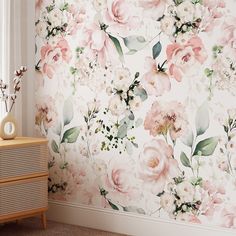 a floral wallpaper with pink flowers and green leaves on the sideboard next to a window