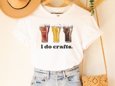 Gift him or her this funny craft beer shirt! It's styled with a watercolor beer art image of 3 craft beer glasses and reads "I do crafts". It would make for the perfect oktoberfest shirt, drinking team shirt, or beer tasting shirt. This classic unisex jersey short sleeve tee fits like a well-loved favorite. Soft cotton and quality print make users fall in love with it over and over again. These t-shirts have-ribbed knit collars to bolster shaping. The shoulders have taping for better fit over ti Cheers And Beers Shirt, Birthday Beer Shirts, Beerfest Outfit Women, Beer Tshirt Design Ideas, Beer Fest Outfit, Beer Shirts For Women, Brewery Merch, Merch Inspiration, Craft Beer Shirts