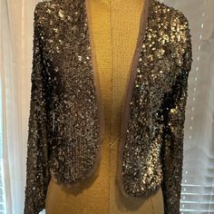 Sequin Metallic Bolero Jacket. There’s A Soft Mesh Lining; It’s Very Soft & Very Comfortable To Wear Casually With Jeans Or Dressed Up. The Color Is Kind Of A Gray Taupe Metallic. Elegant Metallic Outerwear With Sequins, Glamorous Fitted Metallic Outerwear, Elegant Metallic Sequined Outerwear, Luxury Metallic Fitted Outerwear, Luxury Single-breasted Jacquard Outerwear, Bolero Jacket, Abercrombie Fitch, Jackets & Coats, Jackets For Women