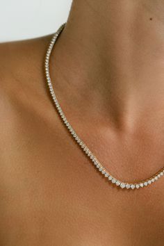 A seamless stream of brilliance, the Diamond Riviera necklace has been one of the most adorned and iconic styles in jewelry since the 19th century. Its graduated Diamonds create a fluid line of light, embodying luxury in its purest form.⁠ Add this piece to your special occasion wear, because you deserve it. THIS ITEM IS MADE-TO-ORDER Due to the rarity and one-of-a-kind nature of our pieces, all items listed through our website are available on a limited availability. Please note our made-to-order projects estimate to be completed in 4-6 weeks. For any questions related to your order, please get in touch with our team via email. Stone Type: Lab Diamond Stone Shape: Round Carat Weight: 11.00ctw. approximate Material Shown: 14K Yellow Gold Finish: Polished Ring Icon, Mix Jewelry, You Deserve It, Diamond Rings Bands, One Ring, Diamond Stone, Rarity, Lab Diamonds