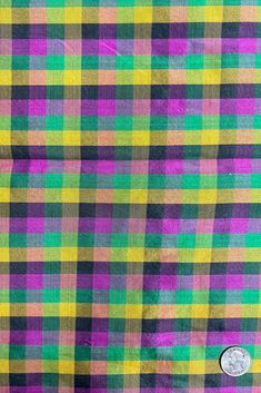 a close up view of a multicolored checkered shirt