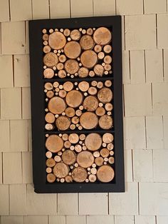 there is a wall decoration made out of wood logs