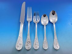 Displaying a gleaming finish, Quintessence by Lunt has a beautiful teardrop profile with different, intricate flower motifs on each piece. Pieces are heavy and well balanced. Scarce multi-motif floral Quintessence by Lunt sterling silver Flatware set, 63 pieces. This set includes: 12 Dinner Knives, 9 7/8" 12 Forks, 7 1/2" 12 Salad Forks, 6 1/2" 12 Teaspoons, 6" 12 Place Soup Spoons, 6 3/4" 1 Serving Spoon, 8 5/8" 1 Pierced Serving Spoon, 8 5/8" 1 Sugar Spoon, 6 1/8" Includes bonus brand new stor Lunt Sterling Silver Flatware, Flower Motifs, Sterling Silver Flatware, Sugar Spoon, Silver Flatware, Salad Fork, Serving Spoon, Big Bend, Serving Spoons