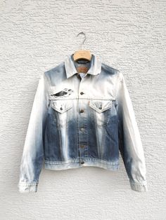 Womens LEVIS Distressed  Denim Jacket . Levi  Strauss  Bleached Trucker Jeans Jacket. The jacket is frayed, distressed, bleached , gradient style, super unique  from the special edition. The size is womens size large but can be worn unisex! Size: L Estimated fit: mens size small, womens size medium and large Condition: 9/10 FLAT MEASURES  Shoulder to shoulder: 44 cm - 17'' Pit to pit: 50 cm - 19.5'' Outer Sleeves Length : 64 cm - 25'' Length from collar on back: 61 cm - 24'' New drop daily!  Add White Denim Jacket With Frayed Hem, Faded Cotton Denim Jacket With Frayed Hem, Faded Denim Jacket With Frayed Hem, Faded Cotton Outerwear With Frayed Hem, Faded Denim Jacket With Frayed Hem For Spring, Faded Pre-washed Cotton Denim Jacket, Spring Faded Denim Jacket With Frayed Hem, Distressed White Denim Jacket For Fall, White Distressed Denim Jacket For Fall