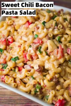 macaroni salad in a white dish on a wooden table