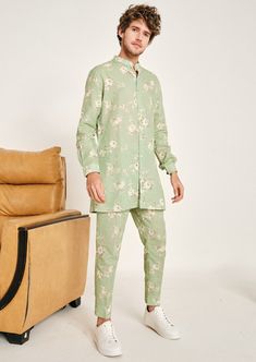 The mint gulab linen kurta pajama set is constructed with a lightweight, luxurious linen fabric. The rose blooms printed on mint linen transport you to an island and instantly make you feel relaxed. This shirt style kurta comes with cuffed sleeves, a mandarin collar, two hip pockets on each side and has a straight hemline. The kurta is not lined. This is a 2 piece set complete with a printed trouser style linen pajama. The trouser style pajama features an elasticated back, zip and fly front closure and two hip pockets and an ankle slit to make the slim fit comfortable to get in and out of. Sabyasachi Menswear, Punit Balana, Mint Green Shirts, Kurta Set For Men, Linen Pajamas, Kurta Pajama, Linen Color, Blooming Rose, Western Wedding