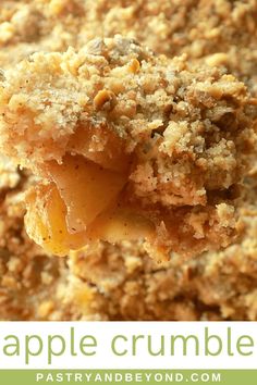 an apple crumble is being held up by a fork with the words, apple crumble