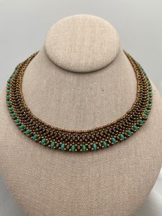 This women's choker necklace is made with superduos and seed beads. The bronze and turquoise colored superduos compliment each other well. It is  light weight and easily attached with the brass box snap closure. Suitable for dressy or casual occasions. West Sacramento, Women Choker Necklace, Brass Box, Womens Chokers, Woman Weaving, Bead Stitching, Choker Necklaces, Seed Bead Jewelry, Turquoise Color