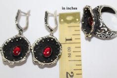 Poppy flower jewelry red poppies SILVER 925 Earrings and ring SET with lab garnet stone Flower Black and red jewelry Floral dark jewellery FREE shipping Worldwide (tracked) Earrings: Sterling silver 925, lab garnet Weight: 15.2 grams Length: 1.8 inch = 4 cm Ring: Sterling silver 925, lab garnet Weight: 10 grams IF YOU NEED JUST EARRINGS, BUT the system requires RING SIZE, just choose Earrings and ANY ring size. In orders I will see that you bought just earrings and paid just for EARRINGS. Shippi Red Hallmarked Jewelry For Party, Hallmarked Red Jewelry For Party, Red Gemstone Jewelry Sets In Sterling Silver, Red Gemstone Sterling Silver Jewelry Sets, Red Oxidized Finish Jewelry, Red Oxidized Finish Round Jewelry, Red Sterling Silver Jewelry Sets For Anniversary, Garnet Black Jewelry For Gift, Elegant Red Flower-shaped Jewelry