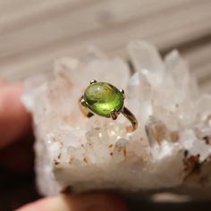 This gorgeous solid gold and Peridot ring has everything you want in a 14 KT Gold Peridot Statement Ring. Gorgeous, smooth Green Peridot cabochon - 8 CT - highlighted and set in 14KT GOLD setting - made to order. Choose your size in the listing. We wanted to show off this gorgeous Peridot Stone in a strong, solid gold prong setting with half-round prongs mimicking the soft cut of this gorgeous, natural Peridot stone. You will love the classic, translucent grass-green peridot in gold. This lovely Yellow Gold Tourmaline Solitaire Jewelry, Polished Peridot Jewelry, Yellow Gold Polished Peridot Jewelry, Round Peridot Jewelry With Polished Finish, Yellow Gold Peridot Jewelry With Polished Finish, Oval Peridot Solitaire Jewelry, Oval Hallmarked Peridot Jewelry, Hallmarked Oval Peridot Jewelry, Oval Peridot Heirloom Jewelry