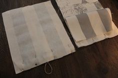 two pieces of cloth sitting on top of a wooden floor