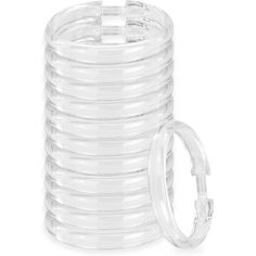 a stack of clear plastic rings on a white background