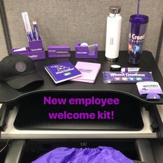 the new employee welcome kit is sitting on top of a desk with other items and supplies