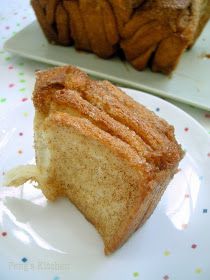 a piece of cake sitting on top of a white plate next to a bundt cake