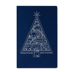 a blue notebook with a christmas tree on it