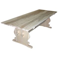 a wooden table sitting on top of a white floor