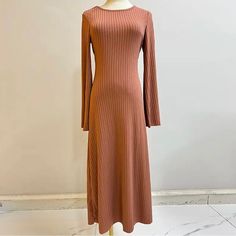 Ribbed Knit Maxi Dress Beautiful Dress With Bell Sleeves And Ties From The Back To Cinch The Waist. Super Soft Comfortable Material As Well. Brand New Size Medium Color- Pale Brown/Light Autumn Orange From My Personal Closet :)! New To Poshmark? Sign Up Now With My Code: Mobeautybae To Save $10 On Your First Order. Tags: Orange Dress, Light Orange Dress, Brown Dress, Brown Maxi Dress, Brown Knit Maxi Dress, Brown Bodycon Dress, Brown Slip Dress, Knit Maxi Dress Brown Ribbed Stretch Dresses, Brown Ribbed Sweater Dress For Spring, Spring Brown Ribbed Sweater Dress, Brown Ribbed Stretch Sweater Dress, Brown Stretch Ribbed Sweater Dress, Stretch Ribbed Brown Sweater Dress, Casual Ribbed Maxi Sweater Dress, Brown Ribbed Knit Dress, Brown Ribbed Midi Sweater Dress