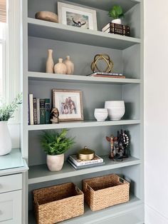 the shelves in this living room are filled with vases, books and other items