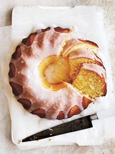 a bundt cake on a napkin with a knife