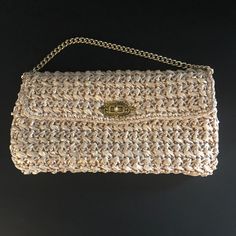 Raffia vintage handbag~  A very elegant handbag to style with your next evening wear. This stylish bag has a gold turn lock to keep things safe but offer that very vintage classy feel. A short gold chain accents this purse for close carrying. Inside is plastic to keep things clean, as well as a small, zippered pocket for credit cards or what not.  The Raffia is in excellent condition on this piece. We are a nonsmoking pet free environment. Elegant Handbag, Vintage Handbag, Clutch Purse Evening, Stylish Bag, Vintage Handbags, Clutch Purse, Clutch Handbag, Credit Cards, Evening Wear