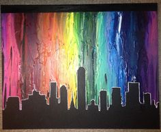 a painting of a city with rainbow paint on it