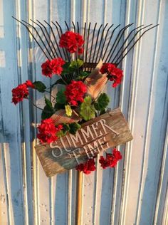 a wooden sign that says summer time with flowers in it