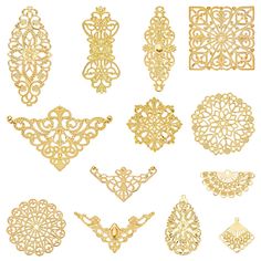 an assortment of gold filigrees on a white background