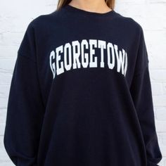 Soft Oversized Sweatshirt In Navy Blue With The Georgetown Graphic On The Chest In White. Fabrics: 100% Cotton Measurement: 29" (74 Cm) Length, 22" (56 Cm) Bust Made In: China Nwot Navy Long Sleeve Collegiate Top, Blue Oversized Varsity Sweatshirt, Blue Varsity Oversized Sweatshirt, Blue College Style Long Sleeve Sweatshirt, Blue Long Sleeve College Style Sweatshirt, Oversized Navy Tops With Letter Print, Navy Oversized Top With Letter Print, Navy Oversized Tops With Letter Print, Blue Collegiate Tops For Campus