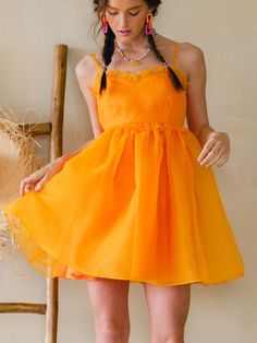 We are obsessed with the Clementine Organza Mini Dress!! Bengals season—but make it fashion! This puffy dress is so SO cute and sure to make you a stand out in any room! You will rock this! 100% Polyester Cute Yellow Dress With Spaghetti Straps, Cute Yellow Dresses With Spaghetti Straps, Cute Yellow Spaghetti Strap Dress, Orange Flirty Dress With Spaghetti Straps, Cute A-line Mini Dress For Party, Flirty Orange Dress With Spaghetti Straps, Flirty Orange Dresses With Spaghetti Straps, Flirty Orange Spaghetti Strap Dress, Summer Orange Mini Dress For Party