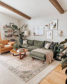 a living room filled with furniture and lots of plants on top of a rug in front of a window