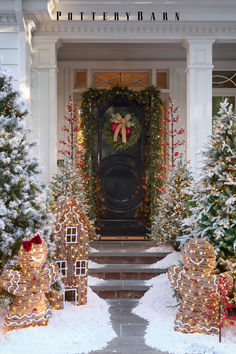 the front entrance to a house decorated for christmas