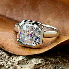 a close up of a ring on a rock